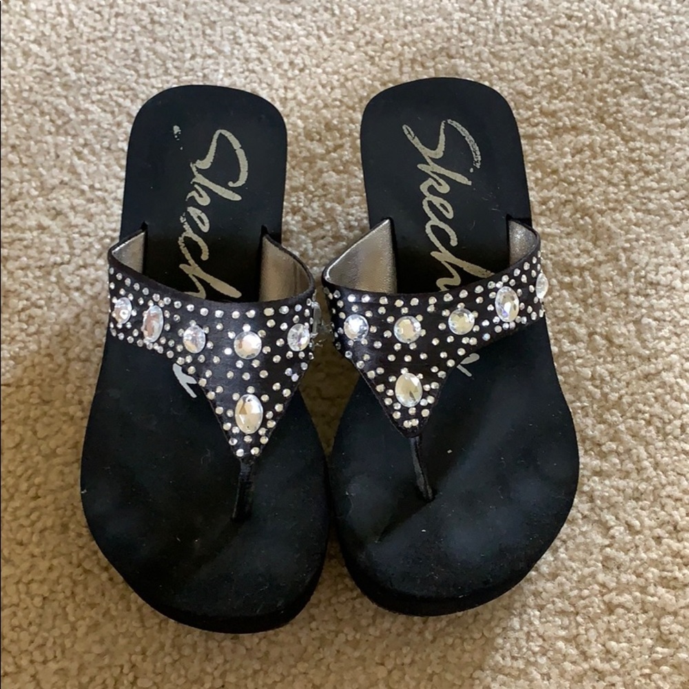 Black thong platform sandals.